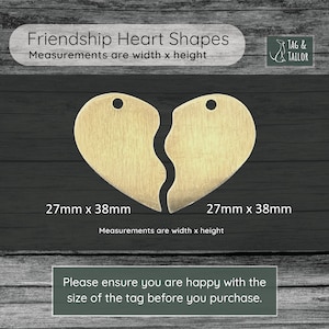 May include: Two gold-coloured heart-shaped metal tags, each measuring 27mm x 38mm. The hearts are broken in half, with a smooth, slightly wavy edge where they would connect. The text "Friendship Heart Shapes" and "Measurements are width x height" is printed above the hearts. The text "TAG & TAILOR" is printed in the top right corner.