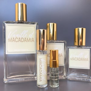 Vanilla Macadamia Perfume Eau De Toilette, three bottles, beige label, sizes 100ml, 50ml and 30ml, 10ml and 3ml tester size perfume