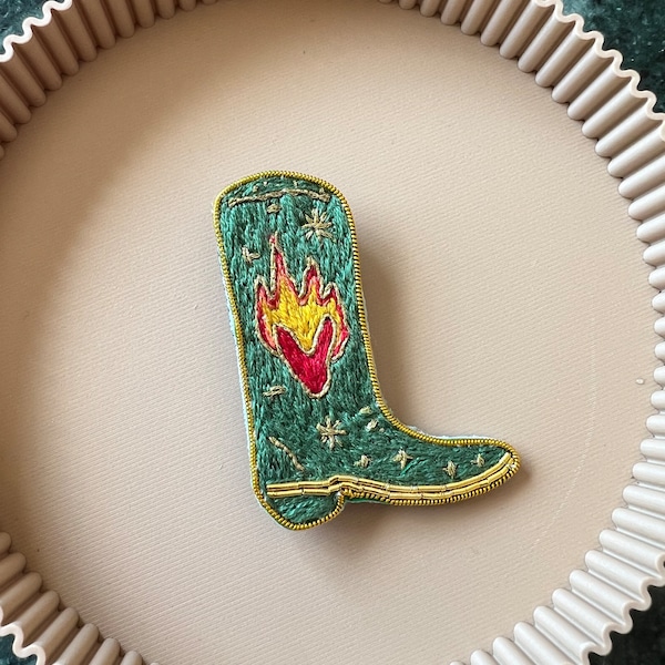 Boots brooch