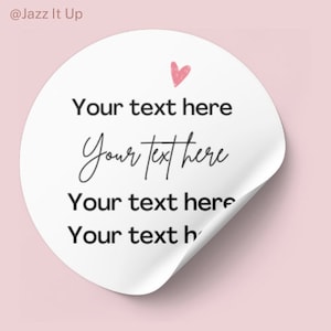 May include: White round sticker with a pink heart and the text "Your text here" repeated four times.