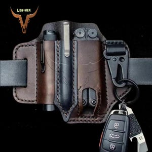 May include: A brown leather belt with a multi-tool, flashlight, and key holder. The belt has a buckle and a loop for attaching to a belt.