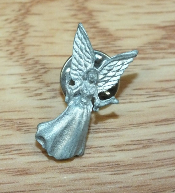 Adorable vintage Christmas angel Pewter angel girl blowing a gold tone trumpet signed Daria designer brooch