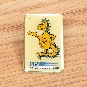 Rare Vintage GM General Motors Natural Gas Powered Dinosaur Logo Pin / Pinback