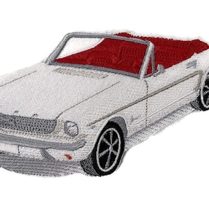May include: White embroidered patch of a classic convertible car with a red interior. The car has a chrome bumper and a detailed grille.