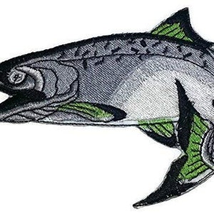 May include: Embroidered iron-on patch of a gray and green salmon fish. The fish is facing left and has a detailed design.