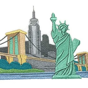 May include: Embroidered patch featuring a green Statue of Liberty, a gray skyscraper, and a yellow bridge with blue accents. The patch is set against a blue water background with green grass.