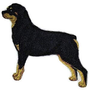 May include: Embroidered patch of a Rottweiler dog in a standing pose. The dog is primarily black with tan markings on its muzzle, chest, and legs. The patch is likely designed to be ironed or sewn onto fabric.