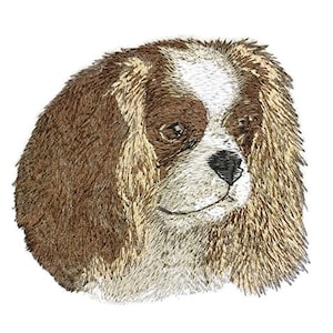 May include: Embroidered image of a Cavalier King Charles Spaniel dog with brown, white, and gold fur. The dog is looking to the right with its tongue slightly out.