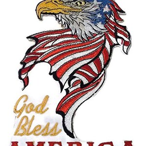 May include: Embroidered patch featuring a bald eagle with outstretched wings, wrapped in an American flag. The eagle's head is turned to the left, and its eyes are visible. The patch has the words "God Bless America" written in gold lettering below the eagle and flag.