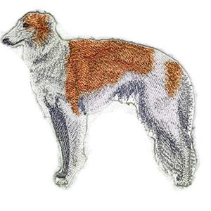 May include: Embroidered patch of a white and brown Borzoi dog standing with its head turned to the left.