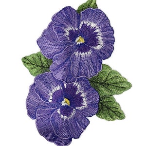 May include: Two purple pansies with white centers and yellow centers are embroidered on a white background. The pansies are surrounded by green leaves.