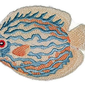 May include: Embroidered patch of a blue and orange angelfish with a white background. The fish has a large, round body and a small tail.