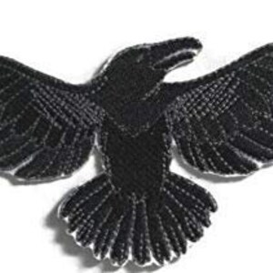 May include: Black embroidered iron-on patch of a raven with outstretched wings.