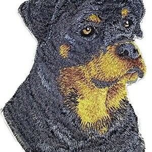 May include: Embroidered patch of a black and brown Rottweiler dog with a serious expression. The patch is made of fabric and has a detailed design.