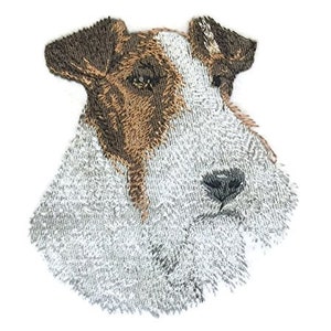 May include: Embroidered patch of a wirehaired fox terrier dog with brown and white fur. The dog is looking to the right with its tongue out.