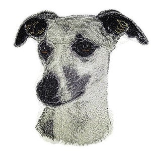 May include: Embroidered patch of a white and grey Whippet dog with black ears and nose.