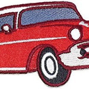 May include: Red vintage car with white trim, a classic American car design. The car is a popular subject for collectors and enthusiasts.