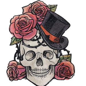 May include: A white skull with a black top hat and pink roses. The skull is smiling and has a detailed design.