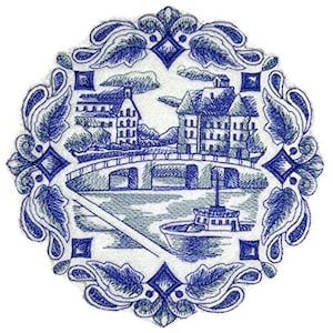 May include: Blue and white embroidered design of a town with a bridge and a boat on a river. The design is surrounded by a decorative border of leaves and diamonds.