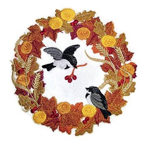 May include: Embroidered design of a fall wreath with two birds perched on branches. The wreath is made of autumn leaves in shades of orange, red, and yellow. The birds are gray and white with black accents.