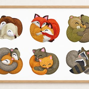 May include: A framed print featuring six embroidered-style illustrations of animal pairs curled together. The pairs include rabbits, foxes, bears, squirrels, cats, and raccoons, all depicted with closed eyes and soft, textured fur details.