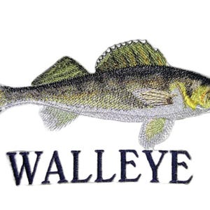 May include: An embroidered patch featuring a detailed depiction of a walleye fish with olive, yellow, and silver thread colours. The fish is shown in profile facing right, with the word WALLEYE stitched in dark blue capital letters underneath it.