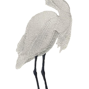 May include: An embroidered patch featuring a white egret standing on a textured brown branch. The bird has a long, slender black beak, a small patch of reddish-brown near the eye, and long, thin black legs with pale yellow feet.
