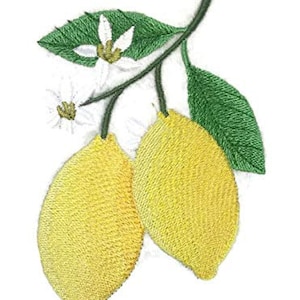 May include: Embroidered patch featuring two yellow lemons with green leaves and white blossoms.