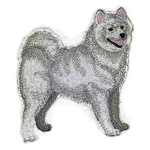 May include: A gray and white embroidered patch of a dog. The dog is standing with its head turned to the side. The dog has a fluffy tail and a long snout.