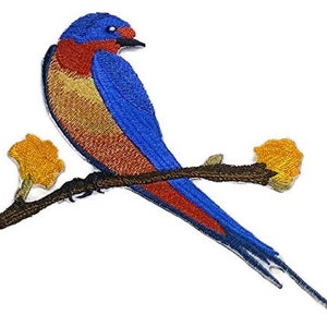 May include: Embroidered patch featuring a colorful bird perched on a branch with yellow flowers. The bird has blue, red, and gold plumage. The branch is brown, and the flowers are yellow. This patch is suitable for clothing or accessories.