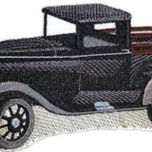 May include: Black and brown vintage pickup truck with a wooden bed, embroidered patch.