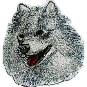 May include: Embroidered iron-on patch of a white fluffy dog with a black nose and a red tongue. The dog is smiling and has a friendly expression.