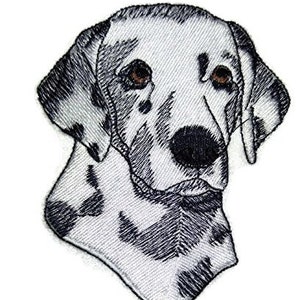 May include: Black and white embroidered patch of a Dalmatian dog's head. The dog has brown eyes and a black nose.