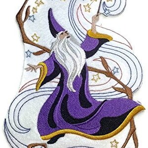 May include: An embroidered iron-on patch featuring a wizard in a purple robe with a white beard, holding a wand and surrounded by swirling clouds and stars.
