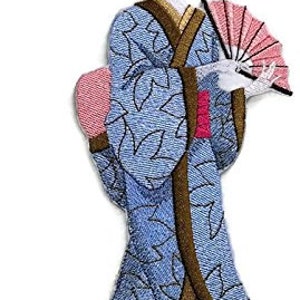 May include: Embroidered iron-on patch of a woman in a blue and gold kimono holding a pink fan.