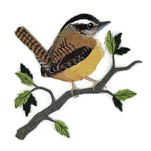 May include: An embroidered patch of a brown and yellow bird perched on a branch with green leaves. The bird has a white stripe on its head.