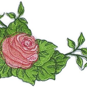 May include: Embroidered patch featuring a pink rose with green leaves and stems. The rose is in the center of the patch and is surrounded by leaves. The stems extend to the right and left of the rose.