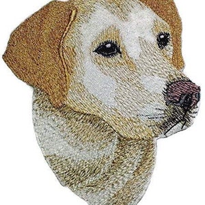 May include: Embroidered patch of a yellow Labrador Retriever dog's head. The dog has brown ears and a white patch on its forehead.