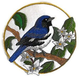 May include: Embroidered iron-on patch featuring a blue and white bird perched on a branch with white flowers. The bird is surrounded by green leaves and the patch has a gold circle border.