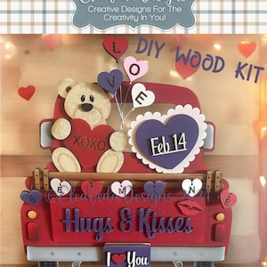 May include: DIY wood craft kit featuring a red pickup truck with a teddy bear holding a heart and balloons that spell out "LOVE". The truck has a heart with "Feb 14" on it and the words "Hugs & Kisses" on the back. The truck has a license plate that says "I Love You".