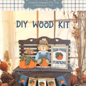 May include: A DIY wood kit featuring a wooden bench with pumpkin and scarecrow cutouts. The bench displays a banner with pumpkin designs and a sign that reads "Farm Fresh Pumpkins". The kit includes the text "DIY WOOD KIT".