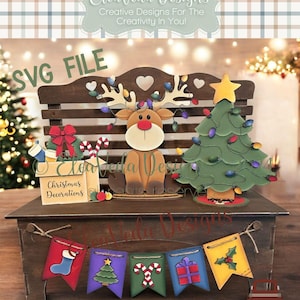May include: A wooden Christmas bench with a reindeer, a Christmas tree, and a banner of Christmas-themed flags. The bench has a sign that says "Christmas Decorations".