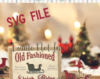 May include: A wooden sign with the text "Old Fashioned Sleigh Rides" and a red "SVG FILE" stamp. The sign features a sleigh graphic and the words "Hot Cocoa and Cookies" and "Warm Blankets". A red sleigh decoration is also present.