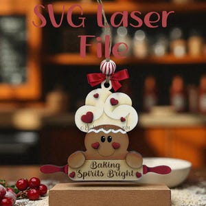 May include: A wooden laser-cut ornament featuring a gingerbread person holding a rolling pin with the text "Baking Spirits Bright." The ornament has a cloud-shaped top with heart accents and a red bow. The text "SVG Laser File" is at the top.