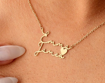 May include: A gold necklace with a heart charm and the names "Emma" and "James" written in cursive.