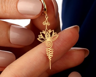May include: Gold-toned earring with a lotus flower and a spiral design.