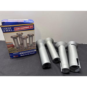 May include: A coin counting kit with a blue and white box and several silver coin counting tubes. The box reads "COUNT & ROLL COIN COUNTING KIT" and "Made in the U.S.A.!"