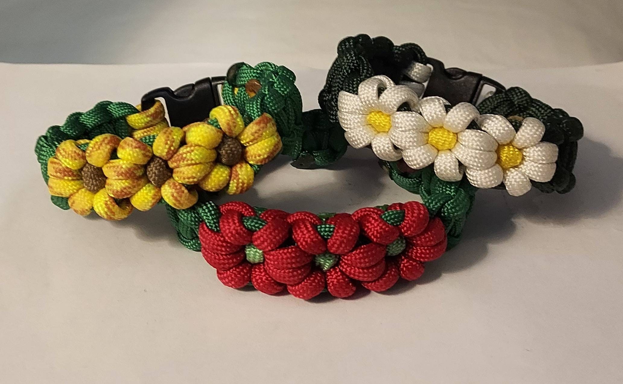 Daisy, Sunflower, Poinsettia Flower Paracord Bracelet Daisy, Sunflower, Poinsettia Flower Paracord Bracelet