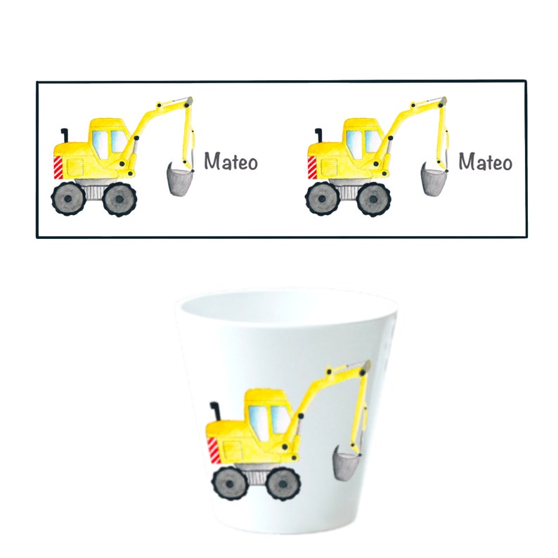 May include: A yellow toy excavator with a gray bucket is on a white cup. The cup has the name "Mateo" written on it.