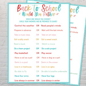 May include: Two printable "Back to School Would You Rather" game sheets. Each sheet has a teal border and features colorful text. The game presents choices like "Control the weather OR Read people's minds."